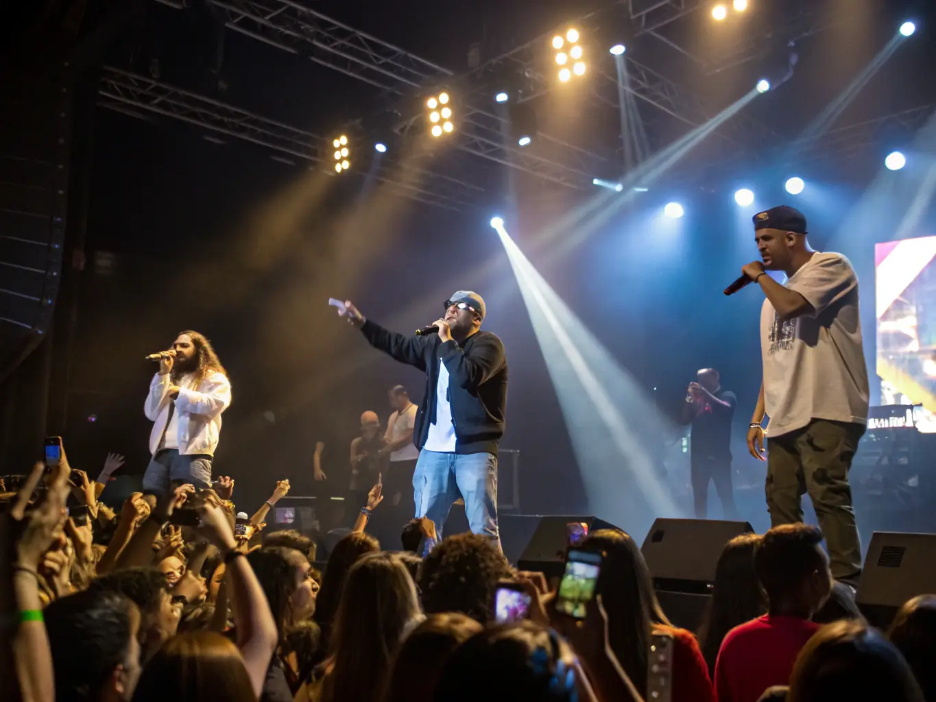 An image of artists from different backgrounds performing together on stage during a cultural exchange event, showcasing the vibrant collaboration and mutual understanding fostered by Vent d'Échange's programs.